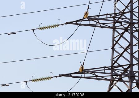 Insulated Electrical Cables On Power Pylon Close-up Stock Photo