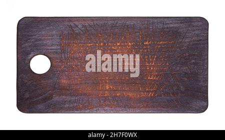Top view of an old kitchen cutting board. Dark cutting board isolated on white background Stock Photo