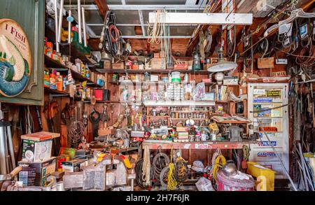 Garage workshop filled with tools and junk Stock Photo