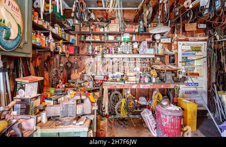 Garage workshop filled with tools and junk Stock Photo