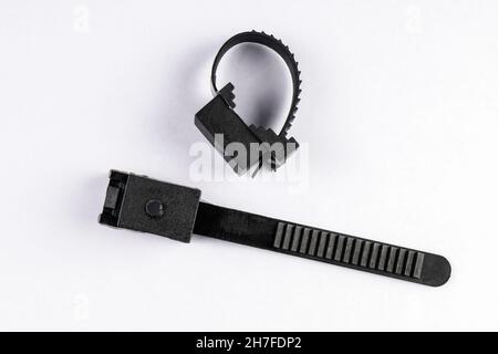 Two black wire clamps on a white background. Stock Photo