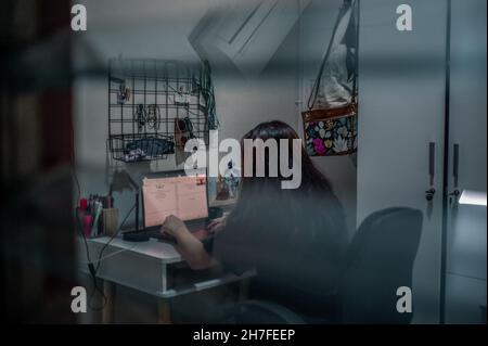 Indonesian female students are studying online in the room. Stock Photo