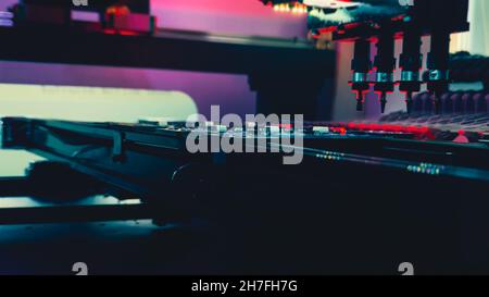 Computer Board with Micro Components Lies on the Table of SMT Machine, Selective Focus, Low Angle. Technology for the precise installation of semiconductors and electronic components on system board. Stock Photo
