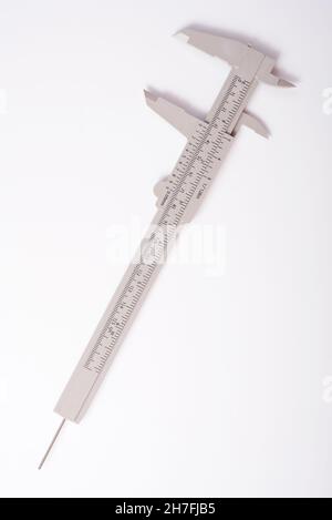 Metal vernier caliper, vernier caliper is a measuring instrument used to precisely measure linear dimensions on white background Stock Photo