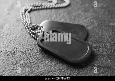 Military dog tags on dark background, closeup Stock Photo