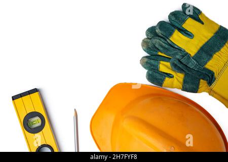 Safety hardhat and work gloves isolated on white background Stock Photo