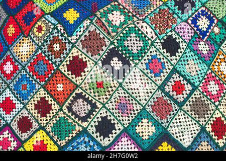 Crocheted wool blanket with colorful checks Stock Photo