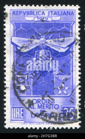 ITALY - CIRCA 1953: stamp printed by Italy, shows Decoration Knights of Labor bee and honeycomb, circa 1953 Stock Photo