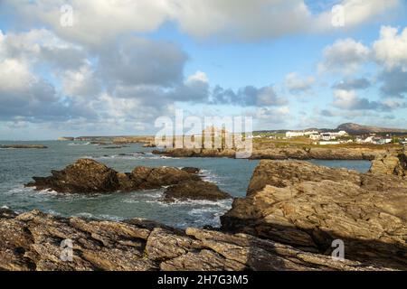 Trearddur bay coast with Holyhead Mountain in the background Stock Photo