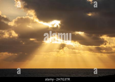 Beautiful Heavens Rays over the sea from Holy Island, Anglesey, Wales Stock Photo