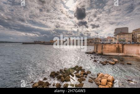 Syracuse Sicily/ Italy -October 19 2021: The breathtaking scenery of the Ortigia seafront in Syracuse Sicily Stock Photo