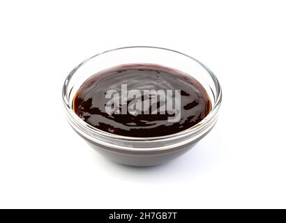 Soy sauce in a transparent cup on a white background. Stock Photo