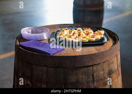 Tray of deviled eggs on a wooden barrel in the bar Stock Photo