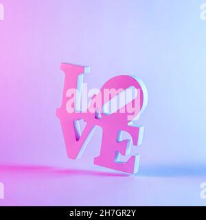 Close-up of a 3d love word with shadow against pastel purple background as romantic greeting card or symbol for dating Stock Photo
