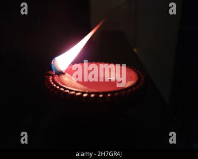 Traditional clay Diya lamps lit during Diwali celebration Stock Photo