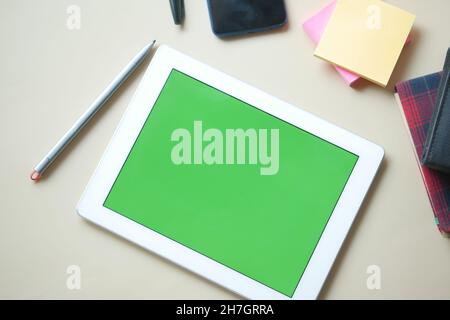 Flat composition of digital tablet and office stationary on black background  Stock Photo