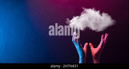 Hand holding icon cloud computing network and icon connection data information in hand. Cloud computing and technology concept Stock Photo