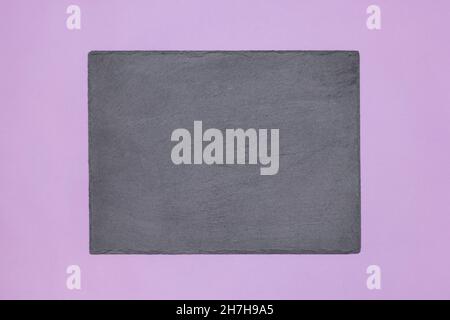 Blank chalk board on purple. Empty black chalkboard. Copy space. Abstract mockup background Stock Photo