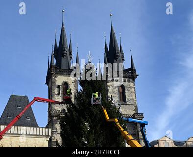 Prague, Czech Republic. 23rd Nov, 2021. Specialists decorate Prague Christmas tree on the Old Town Square in Prague, Czech Republic, on November 23, 2021. Credit: Michal Krumphanzl/CTK Photo/Alamy Live News Stock Photo