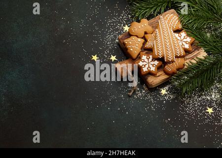 Christmas gingerbread cookies on textured table background Stock Photo
