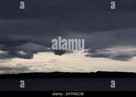 dramatic storm clouds moving approaching Novigrad, Istria, Croatia, Europe. Stock Photo