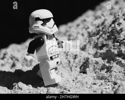 Chernihiv, Ukraine, July 13, 2021. An imperial stormtrooper walks on the surface of the moon, a plastic minifigure. Illustrative editorial. Stock Photo