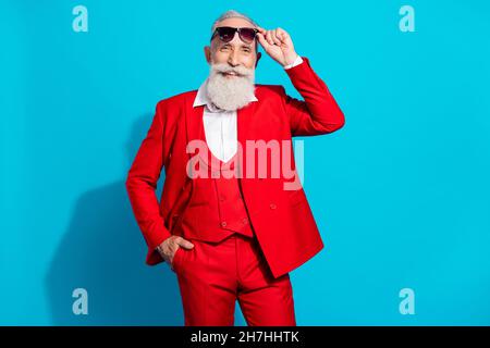 Photo portrait stylish elder businessman wearing sunglass red suit smiling happy isolated bright blue color background Stock Photo
