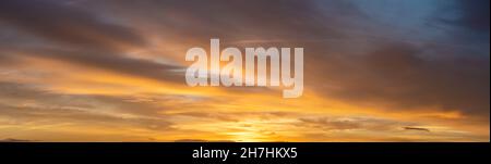 Fiery sunset, colorful clouds in the sky Stock Photo