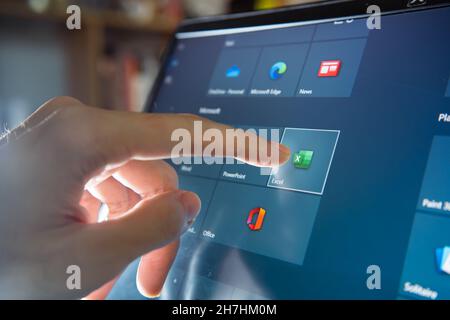 Bangkok, Thailand - November 20, 2021 : Computer user touching on Microsoft Excel icon to open the software. Stock Photo
