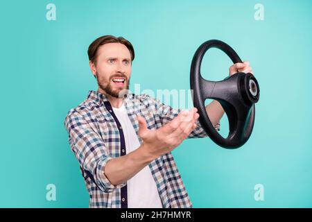 Profile side photo of young man hold steering-wheel angry blame driver angry isolated over teal color background Stock Photo