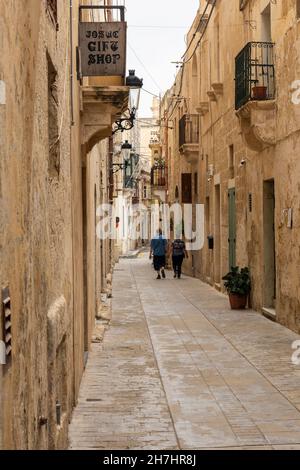 Picturesque narrow alley in The Silent City of Mdina in Malta, Europe. A historic fortified ancient walled city on UNESCO World Heritage list. Stock Photo