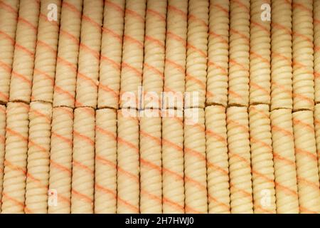 Sweet sticks with stuffing wrapped in a roll . Top view of dessert. Food close-up. Stock Photo