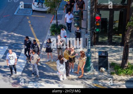 NEW ORLEANS, LA, USA - OCTOBER 31, 2021: Downtown gathering of football fans headed to the New Orleans Saints game Stock Photo