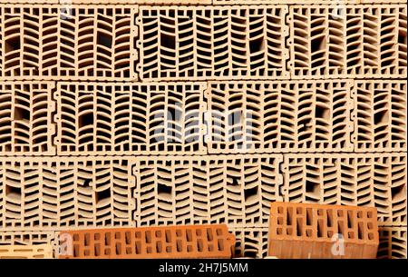 A stack of large-format ceramic blocks, wall ceramic materials used in modern building construction. Stock Photo