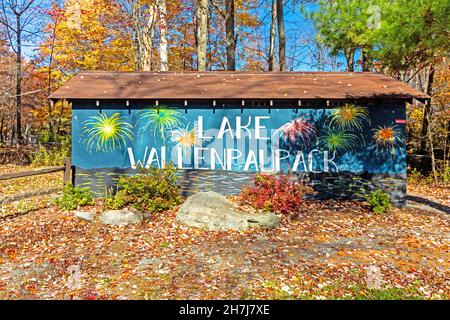 Lake Wallenpaupack Clubhouse Sign in Poconos PA on a bright fall day lined with trees in vivid and beautiful foliage Stock Photo