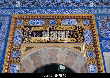 Istanbul, Turkey - November 2021: Ornate ceramic tiles and Arabic inscription on a wall in Topkapi Palace. Stock Photo