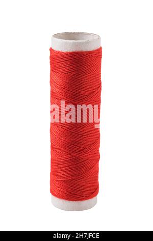 Spool of thread in red, isolated on white background Stock Photo