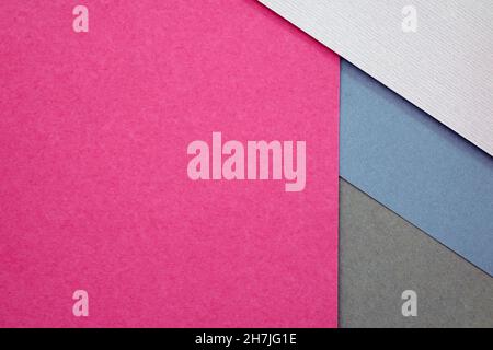 Thick paper of different colors top view. background with geometric shapes. Abstract background from sheets of grey, pink and blue paper. Abstract pap Stock Photo