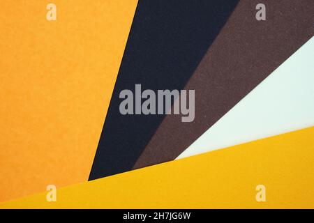 Abstract background from sheets of orange, and brown paper. Abstract paper colorful background, creative design. background with geometric shapes, dia Stock Photo