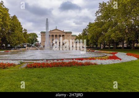 Poznan, Poland - October 2 2020: Square with fountain in Mickiewicz park in front of The Grand Theater of Stanisław Moniuszko Stock Photo