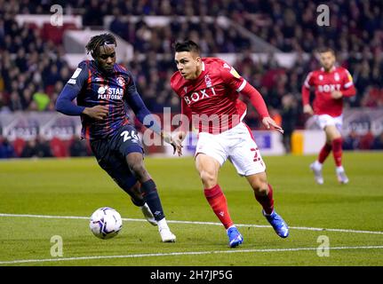 Nottingham Forest's Braian Ojeda (right) and Luton Town's Admiral Muskwe battle for the ball during the Sky Bet Championship match at the City Ground, Nottingham. Picture date: Tuesday November 23, 2021. Stock Photo