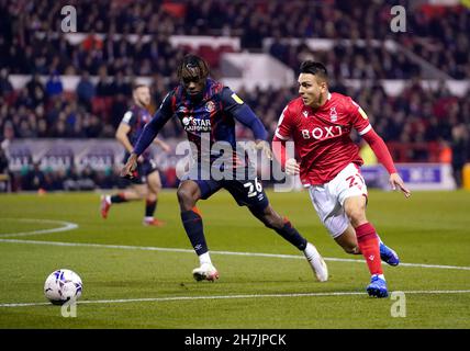 Nottingham Forest's Braian Ojeda (right) and Luton Town's Admiral Muskwe battle for the ball during the Sky Bet Championship match at the City Ground, Nottingham. Picture date: Tuesday November 23, 2021. Stock Photo