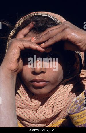 A Baluch girl, at the village of Sultan Koth, in Sibi district of the Beluchistan province in Pakistan. The Sibi district is the warmest region in Pak Stock Photo