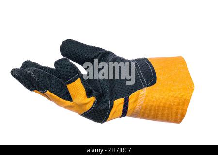 This is kind of one construction glove insulated on white background. Yellow crag with palm up. Collage object. New and clean overalls. Stock Photo