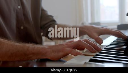 A photo of hands which are playing piano Stock Photo