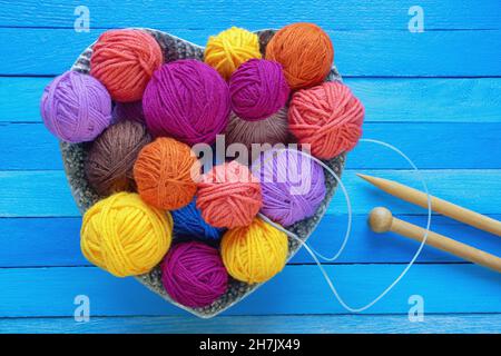 Hobbies and knitting concepts. Bright balls of wool and  knitting needles. Flat lay, copy space Stock Photo