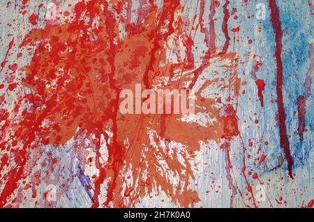 Red and blue paint splashes on grunge wall. Abstract hand painted backdrop for your design Stock Photo