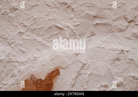 Vintage background with old white concrete wall and retro wallpaper fragments. Backdrop for your design Stock Photo