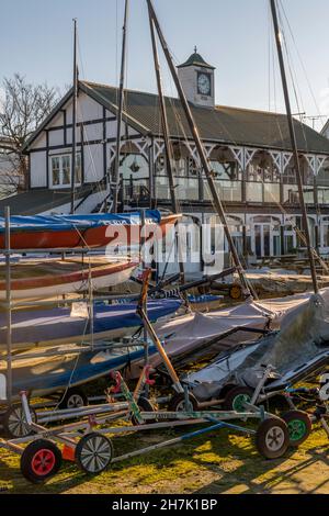 sailing club at bembridge on the isle of wight coast in the harbour, bembridge sailing club on the isle of wight shoreline, dinghies in compound masts Stock Photo