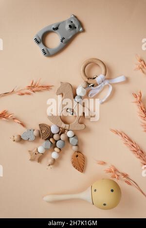 Children's wooden toys, rattles and teethers. Copy space. Stock Photo